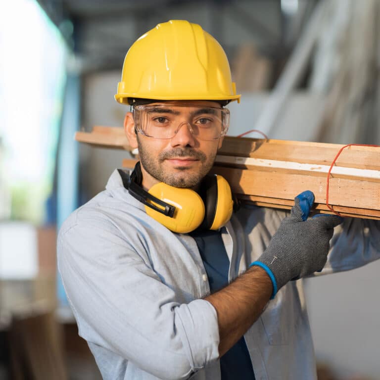 Male carpenter working at wood workshop